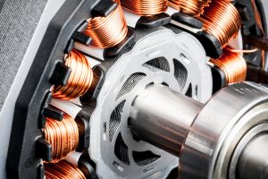 An electric permanent magnet motor containing a stack, shaft and copper wire coils.   
