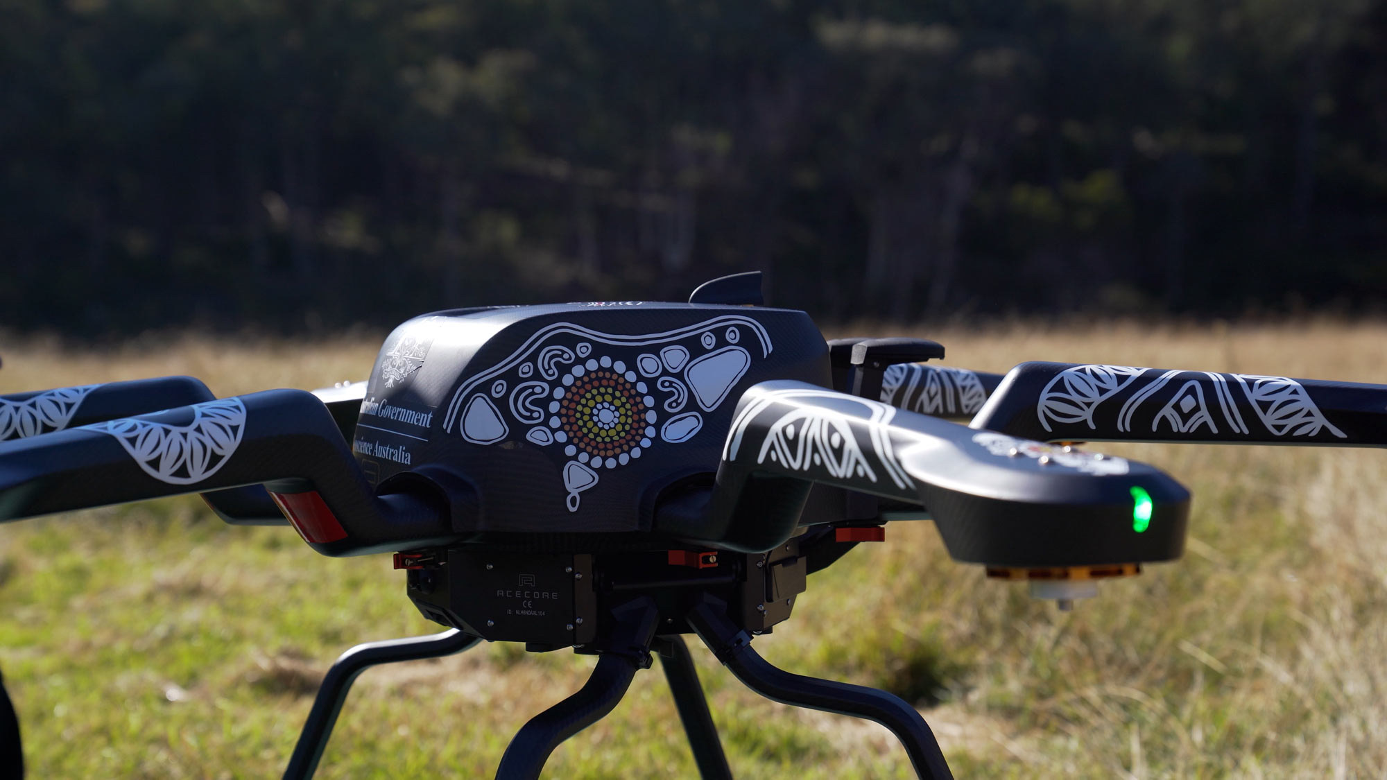 Large drone on ground decorated with Aboriginal line artwork of eagle